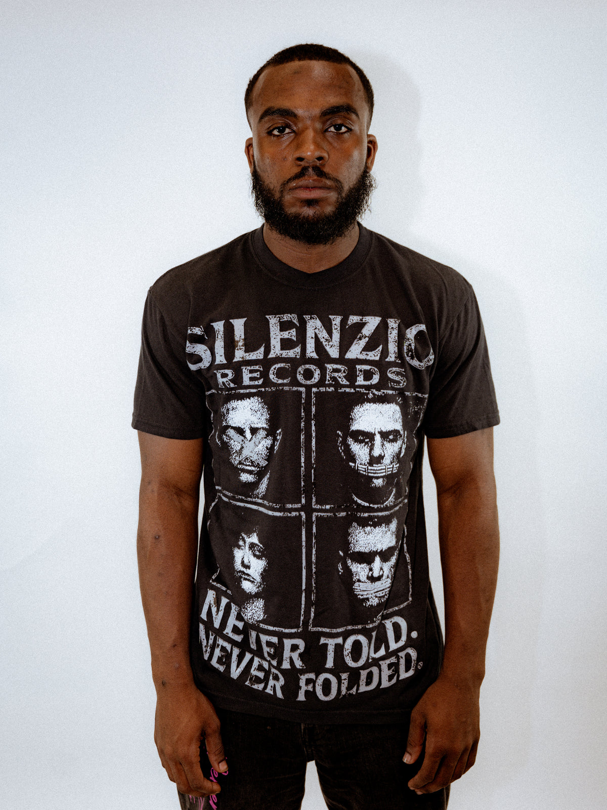 SILENZIO — NEVER TOLD. NEVER FOLDED. TEE